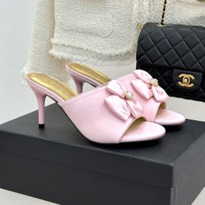 Chanel G46772 Double Bow 75 Slides Women in Silk Light Pink