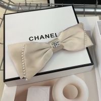 Chanel Bow Hair Clip with Crystal Logo and Pearl Embellishment in Satin Apricot
